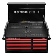 A black and red Craftsman V Series tool chest with an open top compartment, several drawers underneath, and CRAFTSMAN branding visible on the front and inside the lid. The unit has side handles and a label indicating it's made in the USA.