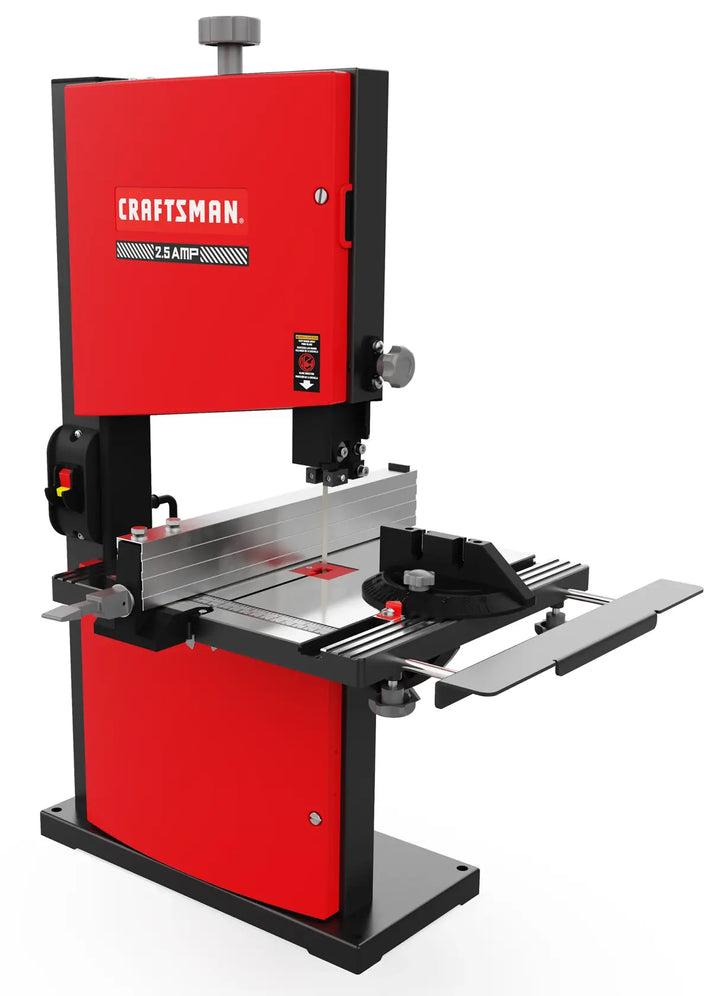 A red and black Craftsman table band saw machine with a metal cutting surface, adjustable fence, and a miter gauge. The tool is designed for woodworking and features a vertical blade for precise cuts.