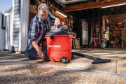 Photo of Craftsman wet/dry vacuum CMXEVBE17596 in use, draining water through the front spout in a garage setting.