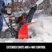 Photo of Craftsman snow blower CMXGBAM1054546 clearing snow with extended chute and 4-way control, side view outdoors.