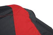 Photo of Craftsman CMXGZAA52002101 cover fabric, close-up of red and black stitching, angled detail view.
