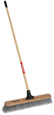 Craftsman CMXMLBA8224A push broom with wooden handle, wide brush head, and gray bristles, angled on white background.