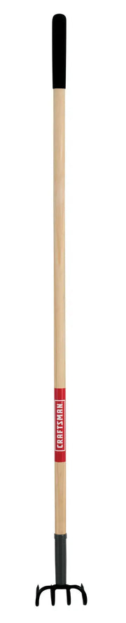 A garden rake with a long wooden handle, a black rubber grip at the top, and black metal tines at the bottom. There is a red label on the handle.