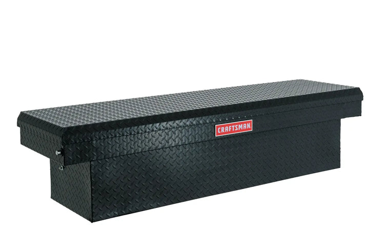 Photo of Craftsman black truck tool box CMXTBAK1005301 with diamond plate pattern, angled view.