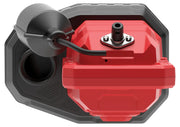 Close-up view of a red and black device, possibly a water pump or sump pump, featuring a float switch attachment and sturdy casing, photographed from above.