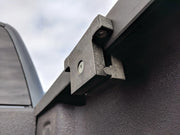 Photo of Craftsman truck bed rail clamp, black finish, SKU CMXZBAD29510601, close-up side angle.
