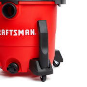 Photo of Craftsman wet/dry vacuum CMXZVBE38681, red body, black wheels shown from side on white background.
