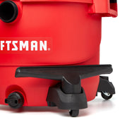 Photo of Craftsman wet/dry vacuum base with drain cap, black wheels and footrest, SKU CMXZVBE38727, side angle.