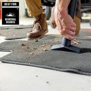 Craftsman nozzle CMXZVBE38741 vacuuming general debris from carpet mat, close-up view.