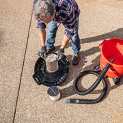 Photo of Craftsman wet/dry vacuum CMXZVBE38754 filter installation with hose and red canister outdoors.