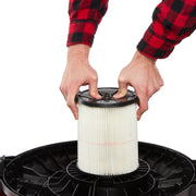 Photo of Craftsman vacuum filter CMXZVBE38755 being installed, vertical pleated white filter with black top.