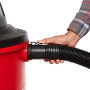 Photo of Craftsman vacuum hose CMXZVBE38758 being attached to a red canister, close-up on white background.
