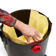 Photo of a Craftsman vacuum with yellow bag being installed in black canister, SKU CMXZVBE3877, top view.