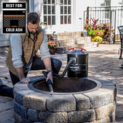 Photo of CRAFTSMAN ash vacuum CMXZVBE43268 used to clean a stone fire pit outdoors; vacuum shown with hose.